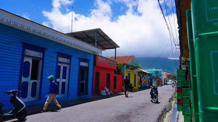 Puerto Plata, DR - May 04, 2022: Local people gouing near colorful buildings in the center of Puerto Plata, Dominican Republicのeditorial素材