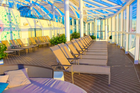 Miami, USA - April 29, 2022: People having fun at pools, bars, entertainment and innovative activities at Symphony of the seas is the biggest cruise ship at Miami, USA on April 29, 2022のeditorial素材