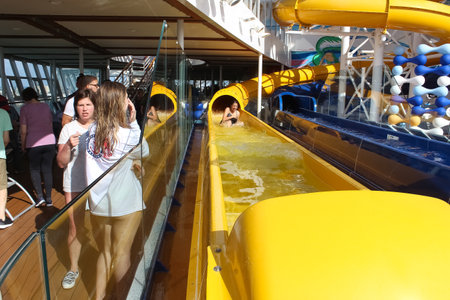 Miami, USA - April 29, 2022: The water park slides and pool area on the new cruise ship Symphony of the Seas by Royal Caribbean.のeditorial素材