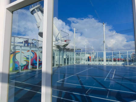 Miami, USA - April 29, 2022: The people playing at upper deck with mini basketball court at cruise liner or ship Symphony of the Seas by Royal Caribbeanのeditorial素材