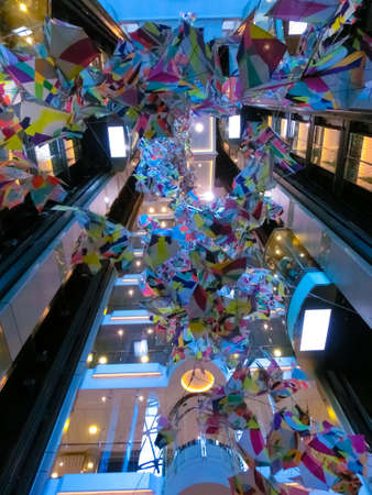 Miami, USA - April 29, 2022: The interior of Promenade at cruise liner Symphony of the Seas by Royal Caribbean. The interior of liftのeditorial素材