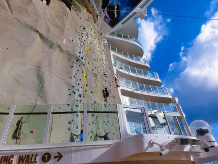 Miami, USA - April 29, 2022: The interior of BoardWalk at cruise liner Symphony of the Seas by Royal Caribbean. The interior of the shipのeditorial素材