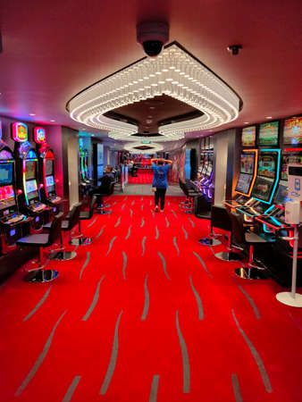 Miami, USA - April 29, 2022: Interior of slot machines in gambling casino on board new cruise ship or new flagship of MSC Seashore, the largest cruise ship built in Italy.のeditorial素材