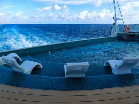 Miami, USA - May 4, 2022: The quiet adult swimming pool area at new cruise ship or new flagship of MSC Seashore, the largest cruise ship built in Italy.のeditorial素材