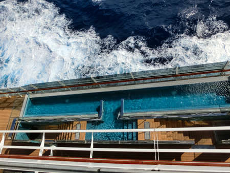 Miami, USA - May 4, 2022: The quiet adult swimming pool area at new cruise ship or new flagship of...