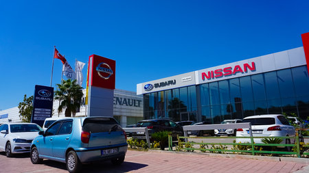 Antalya, Turkey - September 17, 2022: Nissan dealership sign in front of showroom store. Nissan is Japanese brandのeditorial素材