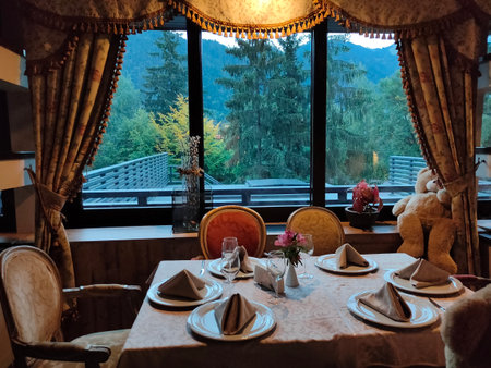 Poiana Brasov, Romania - September 26, 2022: Alpin Resort Hotel dining table at Poiana Brasov, Romania.のeditorial素材