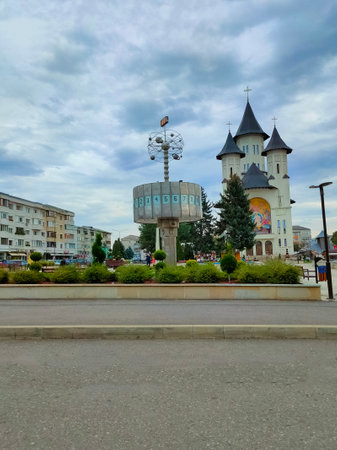Falticeni, Romania - September 26, 2022: Main Square with Orthodox Church and World Clock. Falticeni is a town in Suceava County, north-eastern Romaniaのeditorial素材