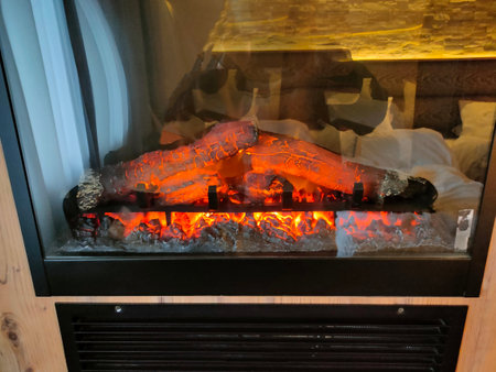 Poiana Brasov, Romania - September 25, 2022: Alpin Resort Hotel room fireplaceのeditorial素材