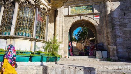 Istanbul, Turkey - September 15, 2022: Entrance Gate of istanbul Laleli Mosque. Ottoman style calligraphy art carved top of the gate door. Laleli mosque is one of the oldest mosques of istanbulのeditorial素材