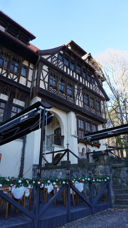 Sinaia, Romania - December 31, 2022: Carol Gastro Bierhaus restaurant next to Peles Castle in the Carpathian Mountains, Prahova Countyのeditorial素材