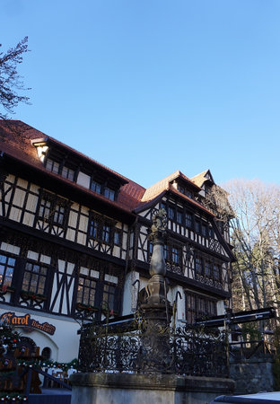 Sinaia, Romania - December 31, 2022: Carol Gastro Bierhaus restaurant next to Peles Castle in the Carpathian Mountains, Prahova Countyのeditorial素材