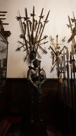 Sinaia, Romania - December 31, 2022: The interior of the Peles castle in Sinaia, in Romania - knightly armor and weapons.のeditorial素材