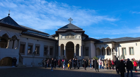 Bucharest, Romania - December 31, 2022: A people near the Patriarchal Cathedral of Saints Constantine and Helena and the Palace of the Patriarchate.のeditorial素材