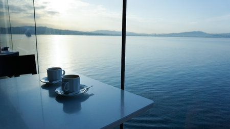 A delicious cup of cappuccino served on an abstract cruise ship.の写真素材