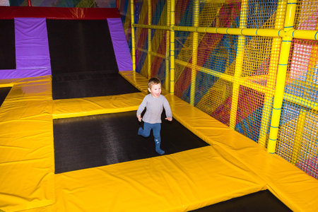 The little boy playing at children's entertainment center or abstract playroom or playgroundの写真素材