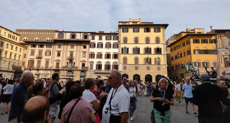 Florence, Italy - September 30, 2023: People going near Fountain of Neptune - a fountain in Florence, located on the Piazza della Signoria or Signoria square at Italyのeditorial素材