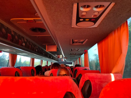 Rome, Italy - October 3, 2023: Group of tourists sitting in the bus and looking through the windows at forestのeditorial素材