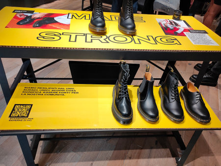 Florence, Italy - October 4, 2023: Dr. Martens Store Shop logo sign of the famous brand for solid shoes and work boots, available in many colors and patterns.のeditorial素材