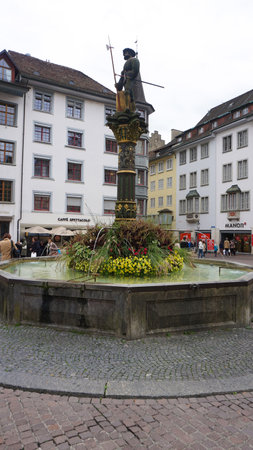Schaffhausen, Switzerland - October 21, 2023: People going at the old town of Swiss City of Schaffhausen on a foggy day at Schaffhausen, Switzerland on October 21, 2023のeditorial素材