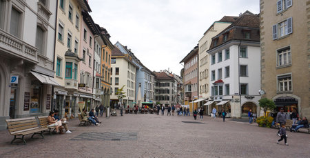Schaffhausen, Switzerland - October 21, 2023: People going at the old town of Swiss City of Schaffhausen on a foggy day at Schaffhausen, Switzerland on October 21, 2023のeditorial素材