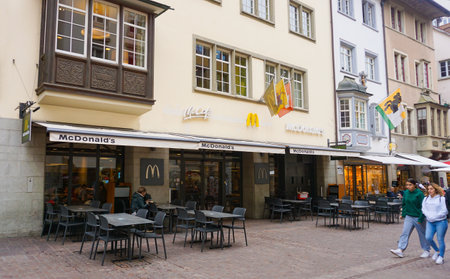 Schaffhausen, Switzerland - October 21, 2023: People going at the old town of Swiss City of Schaffhausen on a foggy day at Schaffhausen, Switzerland on October 21, 2023のeditorial素材