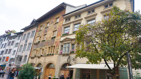 Schaffhausen, Switzerland - October 21, 2023: People going at the old town of Swiss City of Schaffhausen on a foggy day at Schaffhausen, Switzerland on October 21, 2023のeditorial素材