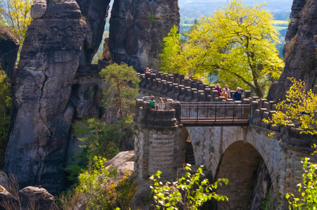 Saxon Switzerland National Park, Germany - April 19, 2124: The people going at Bastei bridge at Saxon Switzerland National Parkのeditorial素材
