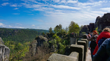 Saxon Switzerland National Park, Germany - April 19, 2124: The people going at Bastei bridge at Saxon Switzerland National Parkのeditorial素材