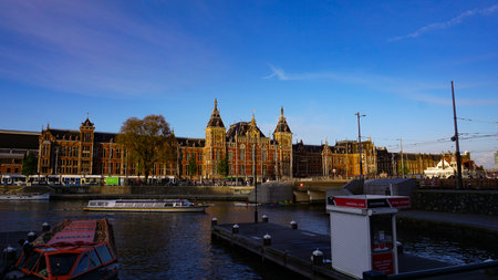 Amsterdam, Netherlands - April 16, 2024: The people going at the central street of Amsterdam,...