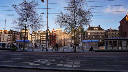 Amsterdam, Netherlands - April 16, 2024: The people going at the central street of Amsterdam, Netherlandsのeditorial素材