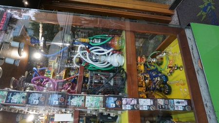 Rimini, Italy - June 25, 2024: Sale of cannabis and other herbs in jars as a souvenir in the store...