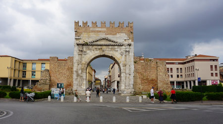 Rimini, Italy - June 25, 2024: People are passing Arch of Augustus, triumphal ancient architecture of Roman Empire, 27 BC at Italyのeditorial素材