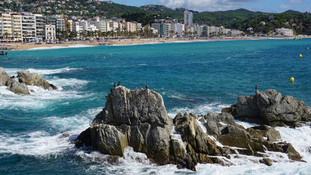 Spain. Beautiful views of the beach of Lloret De Mar. The beach in Costa Brava of Catalonia at sunny dayの写真素材