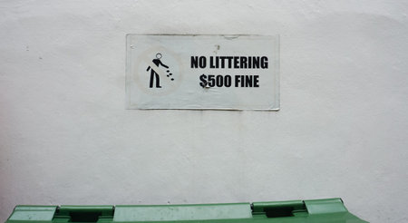 Sign No littering in Singapore on wall at streetの写真素材