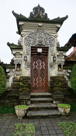 Beautiful wooden door decorated with carvings, Ubud at Bali, Indonesiaの写真素材