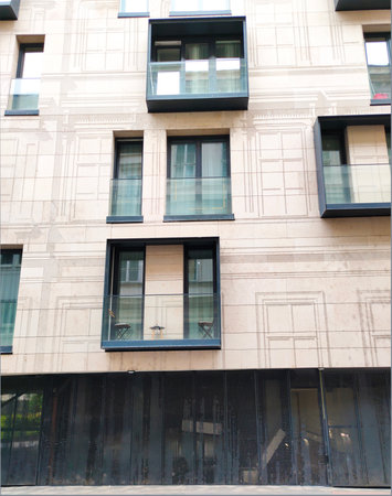 Modern panel building, featuring a geometric facade with warm tones at Budapest. A typical example of Eastern European architecture urban.の写真素材