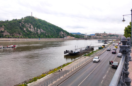 Exterior view of historical old town buildings and River Danube in the downtown of Budapest, Hungary, Europe. Panoramic riverside, details of Margaret Bridge, and colorful houses along the quayside.の写真素材