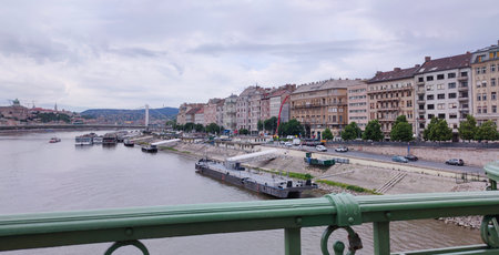 Exterior view of historical old town buildings and River Danube in the downtown of Budapest, Hungary, Europe. Panoramic riverside, details of Margaret Bridge, and colorful houses along the quayside.の写真素材
