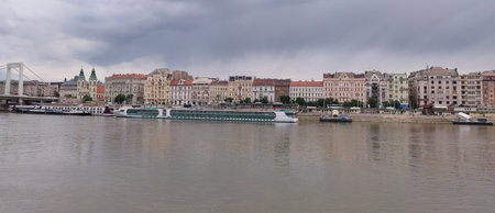 Exterior view of historical old town buildings and River Danube in the downtown of Budapest, Hungary, Europe. Panoramic riverside, details of Margaret Bridge, and colorful houses along the quayside.の写真素材