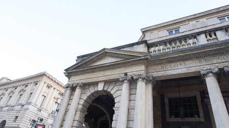 Verona, Italy Latin inscription -For the beauty and benefit of the citizens- at public expense on the portal of Piazza Bra, built in 1929 during the Fascist Era. Neoclassical facade with columnsの写真素材