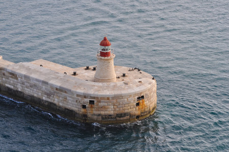 Lighthouse at the entrance to the Grand Harbour, Valletta (Il-Belt) the capital of Maltaの写真素材