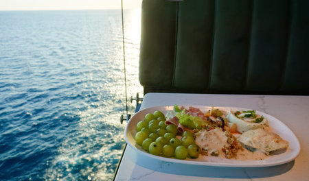Dining Room Buffet aboard the abstract luxury cruise ship. Healthy food at modern liner conceptの写真素材
