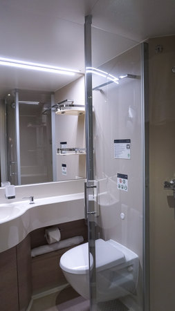 Barcelona, Spain - September 26, 2025: The interior of Bathroom with shower cabin, toilet on a cruise ship MSC World Europaのeditorial素材