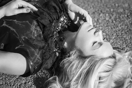 woman lay on the floor. Studio shotの写真素材