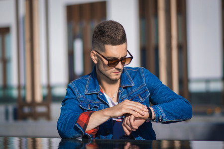 Young attractive man in urban backgroundの写真素材