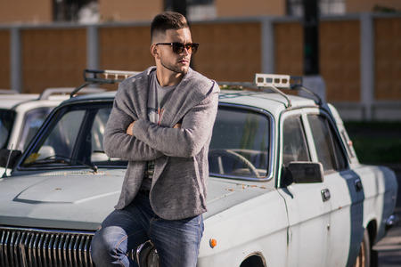 Young attractive man in urban background