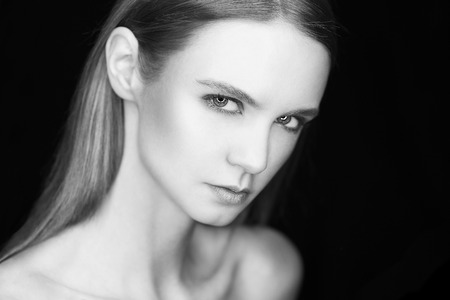 Beautiful calm woman in low key. black and whiteの写真素材