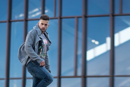 Young stylish attractive man in urban background