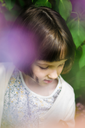 Pretty little girl on the meadow in spring dayの写真素材